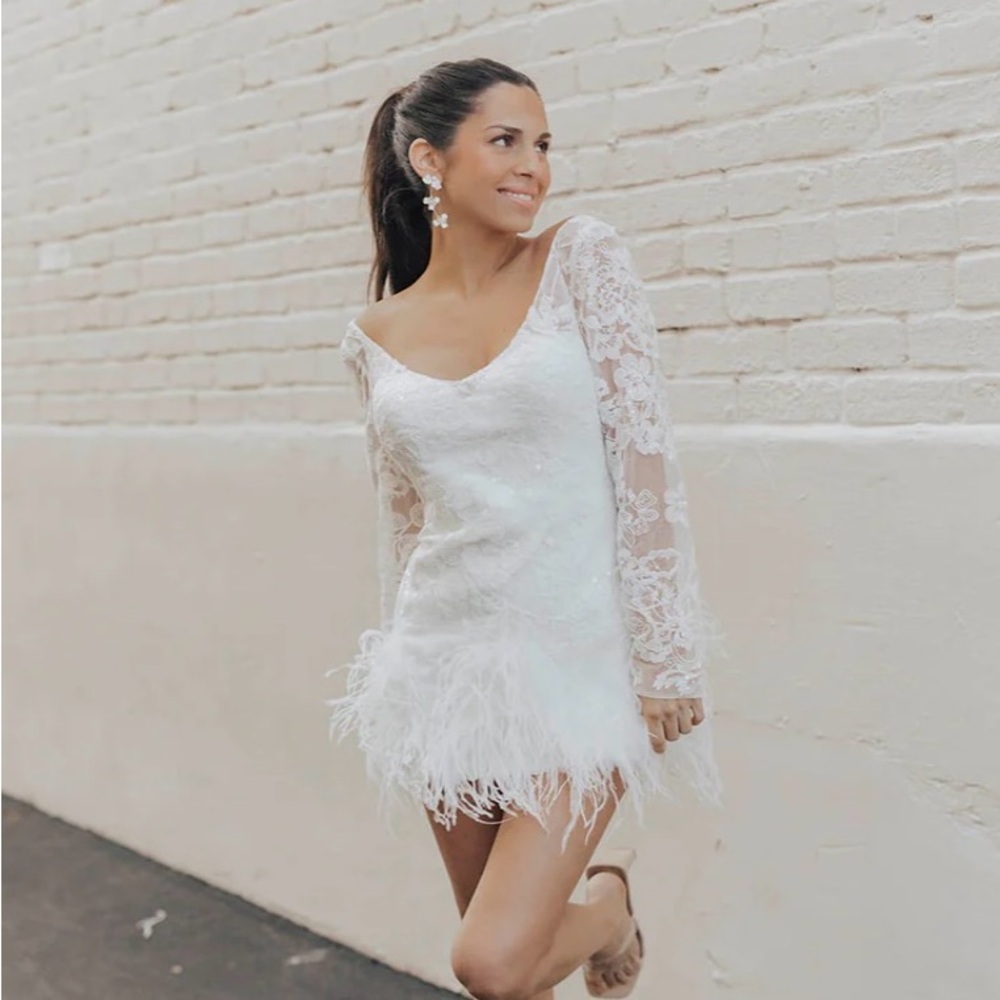 Elegant White Lace Bridal Dress with Feather Details